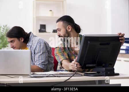 Two it specialists working in the office Stock Photo