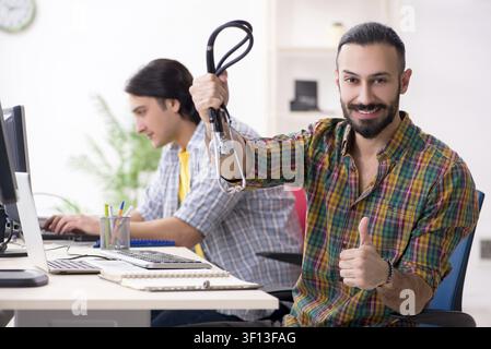 IT engineers working on hardware issue Stock Photo