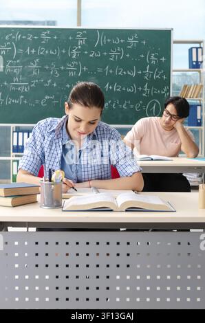 Young students taking the math exam in classroom Stock Photo