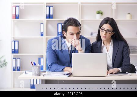 Two employees working in the office Stock Photo