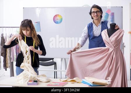 Young tailors working in workshop Stock Photo