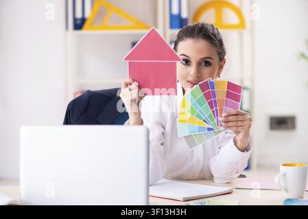 Female beautiful designer working in the office Stock Photo