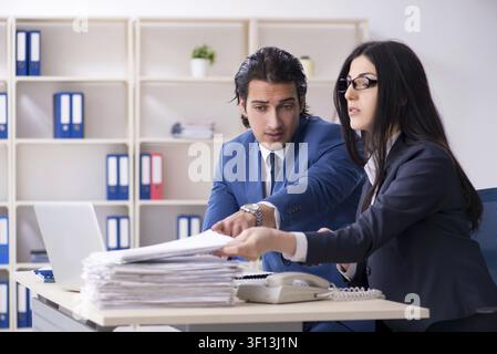 Two employees working in the office Stock Photo