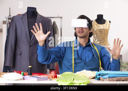 Young male tailor working at workshop Stock Photo