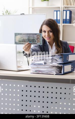 Beautiful female employee unhappy with excessive work Stock Photo