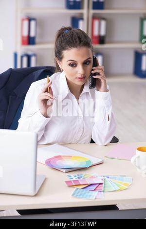 Female beautiful designer working in the office Stock Photo
