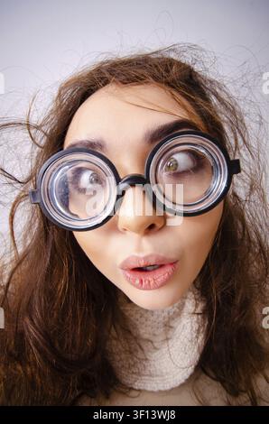 Funny nerd girl working on computer Stock Photo