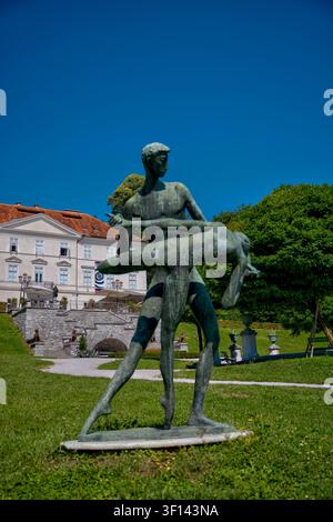 Ballet, a 1957 bronze sculpture by Slovenian artist Stojan Batič, depicting a male ballet dancer holding a female dancer outside Tivoli Mansion in Lju Stock Photo