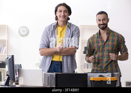 IT engineers working on hardware issue Stock Photo