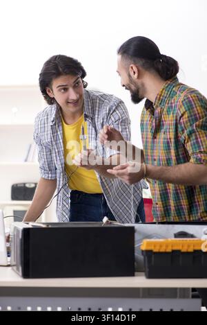 IT engineers working on hardware issue Stock Photo