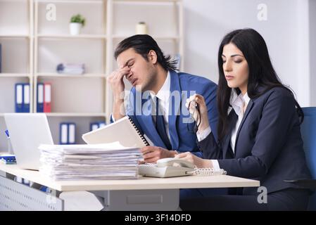 Two employees working in the office Stock Photo