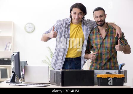 IT engineers working on hardware issue Stock Photo