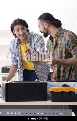 IT engineers working on hardware issue Stock Photo