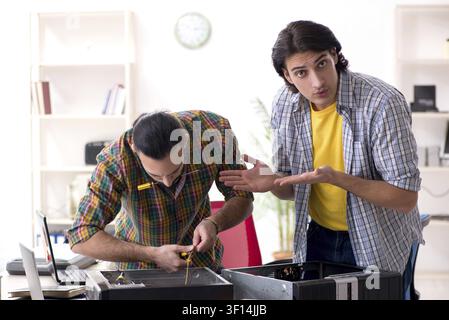 IT engineers working on hardware issue Stock Photo
