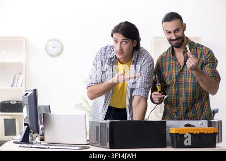 IT engineers working on hardware issue Stock Photo