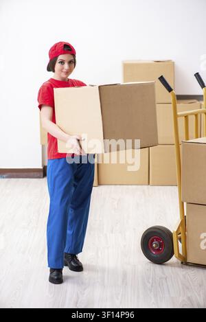 Young female professional mover doing home relocation Stock Photo