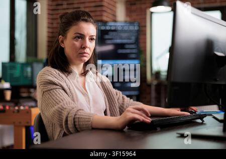 System administrator upgrades firewall for network stability with code, databases and network security work focused on data protection, firewalls and software development Stock Photo