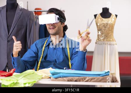 Young male tailor working at workshop Stock Photo