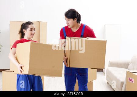 Professional movers doing home relocation Stock Photo