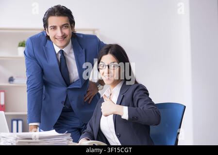 Two employees working in the office Stock Photo