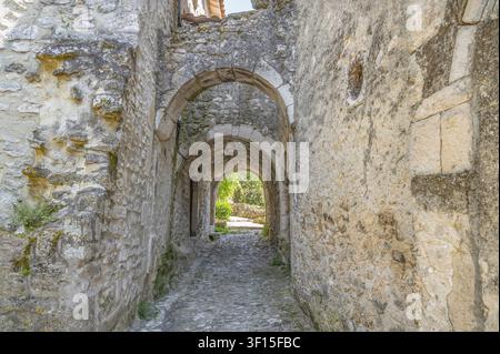Historic Grand Portail as a fortified, medieval city gate with stone arched vaults in a rustic alley of the old town village, which is awarded as Plus Stock Photo