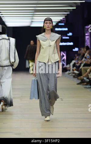Berlin, Germany, 2nd Jul, 2026. A model walks the runway for designer Marlen Linck at Neo Fashion during Berlin Fashion Week, wearing a tailored vest. Stock Photo