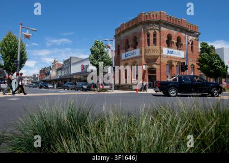 A grand historic brick bank building in Tasmania has been cleverly repurposed as a Just Cuts hair salon, blending heritage charm with modern retail. Stock Photo