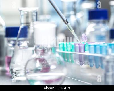 Genetic research, conceptual image. Scientist extracting samples using a pipette for analytical testing in the lab. Stock Photo