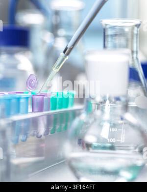 Genetic research, conceptual image. Scientist extracting samples using a pipette for analytical testing in the lab. Stock Photo