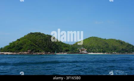 Two Lush Green Tropical Islands Calm Deep Blue Sea Water Clear Distant Horizon Wide Ocean View Stock Photo