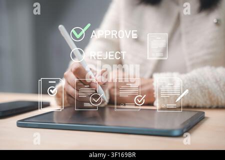 Using tablet, technology, digital screen, businesswoman signs virtual contract and approves electronic document with stylus pen in modern paperless of Stock Photo