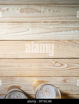 Two beer glasses on wooden table with copy space top view Stock Photo