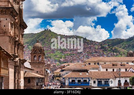 Cusco, Peru - March 23, 2025: Cusco cityscape with historic churches and mountain side neighborhoods. Stock Photo