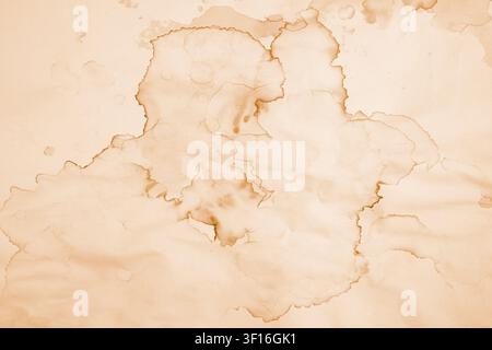 Water damaged beige paper with brown marks and coffee stains, abstract backdrop or overlay template Stock Photo