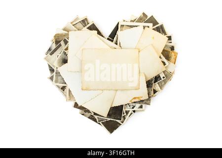 Stack old blurred sepia photos with blank copy space , Formed in Heart Shape isolated on white background. Stock Photo