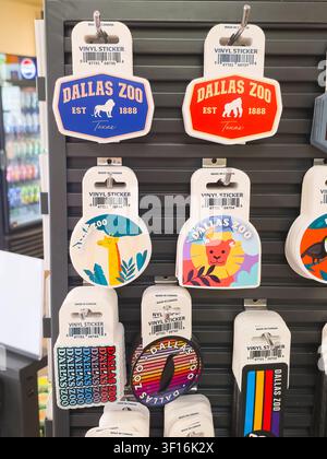 DALLAS, TX, USA - JULY 10, 2026: A display of colorful vinyl stickers featuring Dallas Zoo branding and various animal designs. Dallas Zoo, establishe Stock Photo