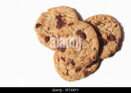 Close-up of four chocolate chip cookies/chocolate chip biscuits isolated in white background. Concept: dessert, sweet, delicious, bakery, pastry Stock Photo