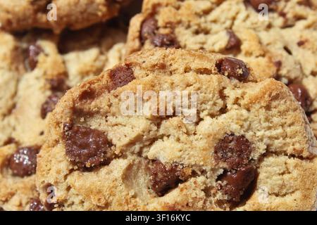 Extreme close-up of four chocolate chip cookies/chocolate chip biscuits. Concept: dessert, sweet, delicious, bakery, pastry, crunchy, bake Stock Photo