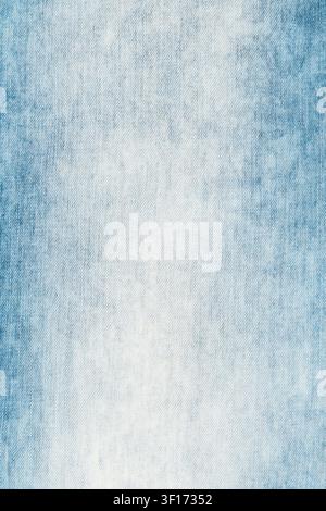Closeup of light blue faded denim texture. Worn out jeans textile background with diagonal weave pattern. Simple, empty cloth backdrop for design or f Stock Photo