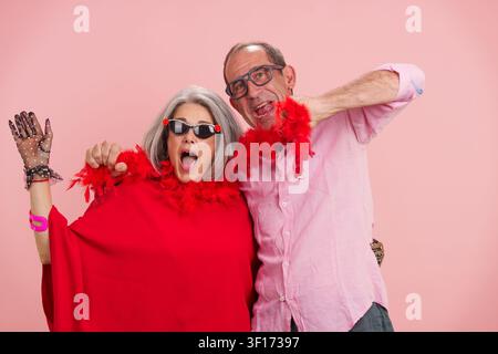 Mature couple having fun celebrating positive active longevity Stock Photo