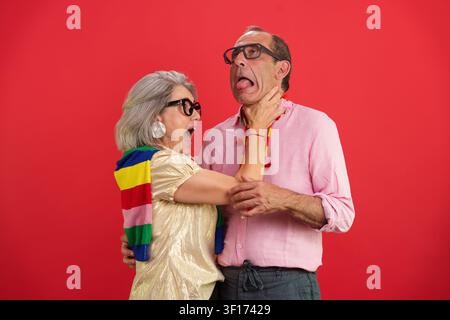 Aging couple having fun, humorous interaction, playing together Stock Photo