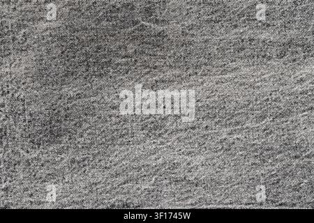 Macro shot of black and white denim fabric. Detailed background of classic gray jeans textile with visible diagonal twill weave. Simple, neutral and v Stock Photo