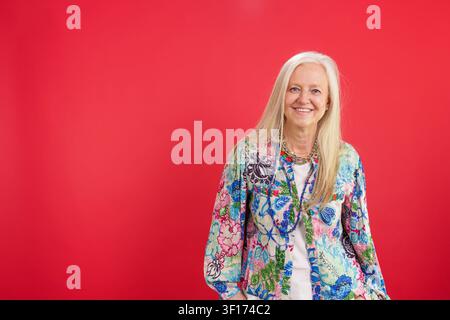 Smiling senior woman enjoying positive aging and vitality Stock Photo