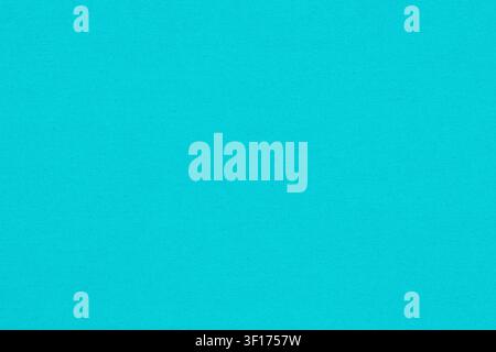 Closeup detail of vibrant turquoise denim fabric. Solid cyan colored textile with fine, even weave. Clean, simple and minimalist background for design Stock Photo