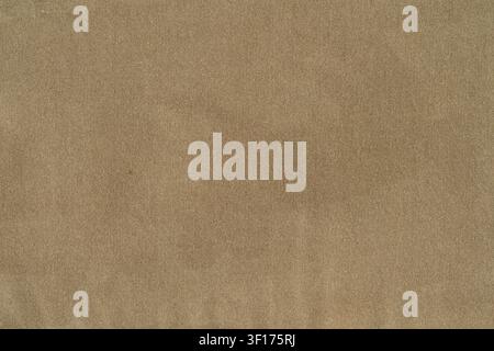 Neutral beige textile with fine woven texture, soft even lighting, minimalist composition. Ideal for backgrounds, design overlays, product mockups Stock Photo