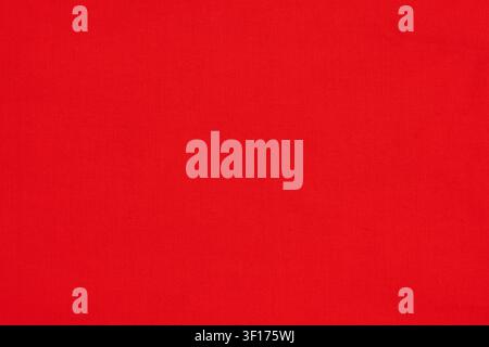 Solid red textile surface with fine woven texture. Even lighting highlights fabric grain. Bold crimson color suitable for design backgrounds, product Stock Photo