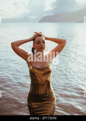 Portrait of a beautiful brunette by the sea Stock Photo