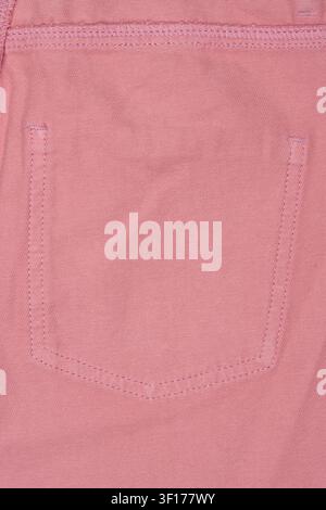 Close up of pink denim fabric showing back pocket with neat stitching textured weave. Soft pastel tone, even lighting highlights material detail Stock Photo