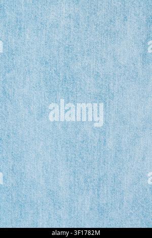 Light blue washed denim fabric texture. Classic jeans textile background with diagonal twill weave pattern. Casual textured surface perfect for design Stock Photo