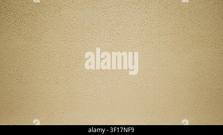 Orange painted surface of the house. Orange texture of decorative plaster. Orange concrete background, plastered wall. Textured background. Stock Photo
